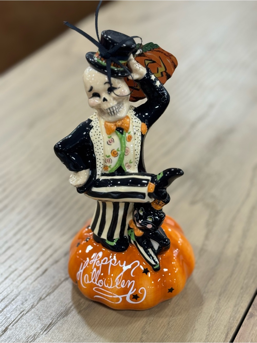Blue Sky Black and Orange Skeleton with Pumpkin Figurine